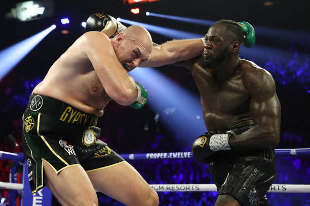 LAS VEGAS, NEVADA - FEBRUARY 22: Deontay Wilder punches Tyson Fury during their Heavyweight bout for Wilder's WBC and Fury's lineal heavyweight title on February 22, 2020 at MGM Grand Garden Arena in Las Vegas, Nevada. (Photo by Al Bello/Getty Images)