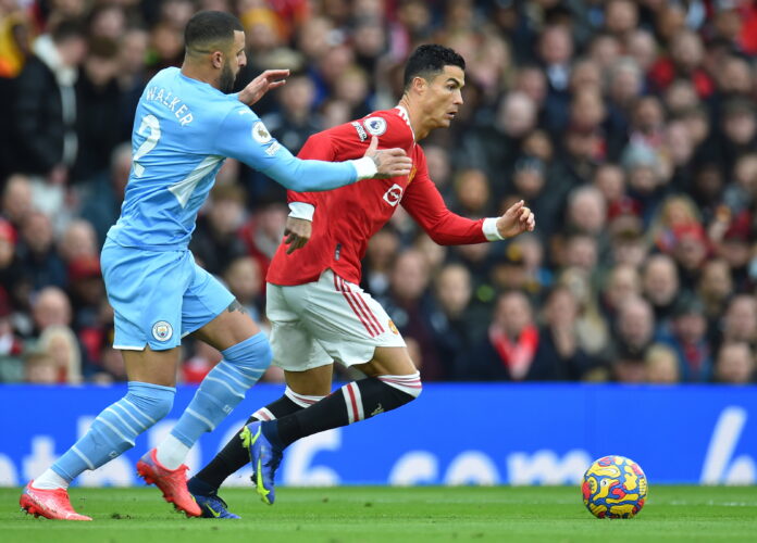 Cristiano Ronaldo (R) of Manchester United in action against Kyle Walker (L) of Manchester City during the English Premier League soccer match between Manchester United and Manchester City in Manchester, Britain, 06 November 2021. EPA/PETER POWELL EDITORIAL USE ONLY. No use with unauthorized audio, video, data, fixture lists, club/league logos or 'live' services. Online in-match use limited to 120 images, no video emulation. No use in betting, games or single club/league/player publications