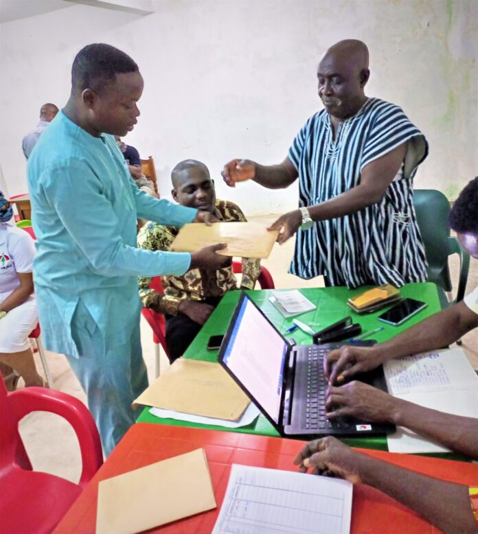 Festus Japhet Gbede submitting his completed documents