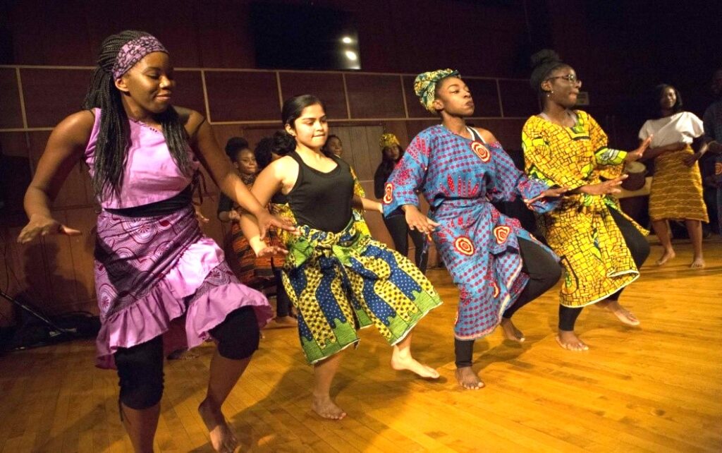 International students exhibiting the Agbadza Dance