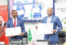 UBA Partners AfCFTA, invest $6bn to finance Small and Medium-scale Enterprises in Africa UBA Group DMD Muyiwa Akinyemi and Secretary-General of the AfCFTA Secretariat, H.E. Wamkele Mene showing the signed MoU