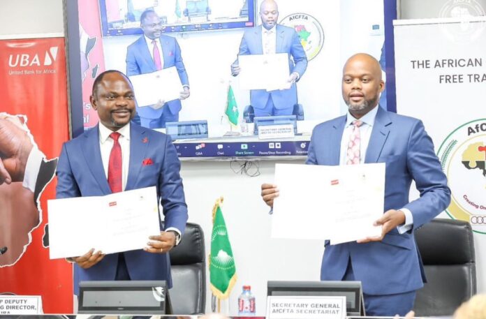 UBA Group DMD Muyiwa Akinyemi and Secretary-General of the AfCFTA Secretariat, H.E. Wamkele Mene showing the signed MoU