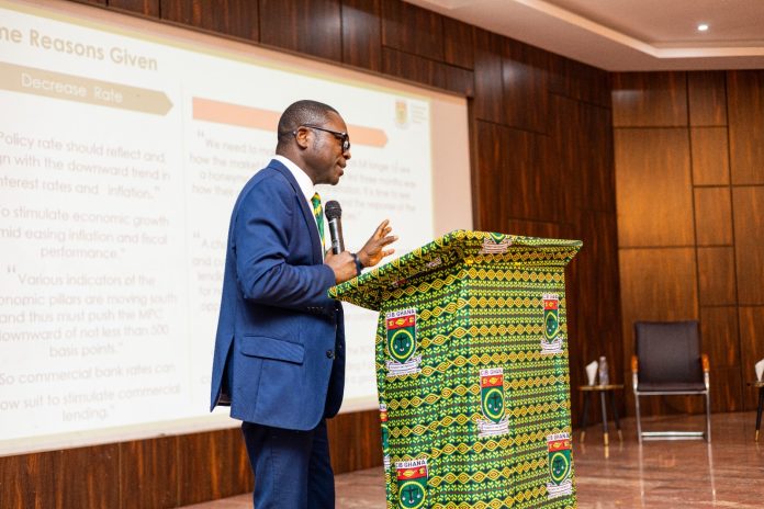 CEO of the Chartered Institute of Bankers, (CIB) Ghana, Robert Dzato presenting on some findings at the event
