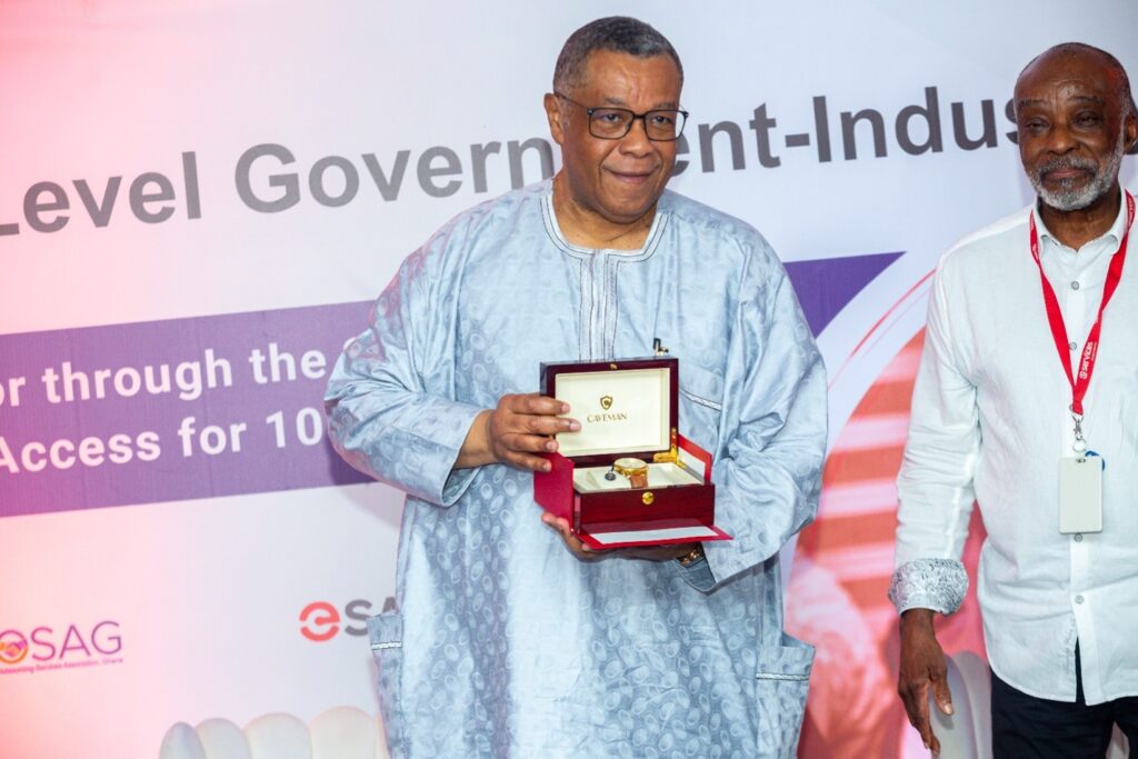 Mr. Augustus Goosie Tanoh, Presidential Advisor to the 24-Hour Economy Authority receives a Ghanaian made watch at the BOSAG High Level Government Industry Roundtable