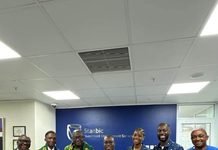 SIMS Supports Prempeh College Waste Management Drive With GHS30,000 Kwabena Boamah, MD, Stanbic investment Management Services with Joseph Osei, President of the 1982 Year Group (Center) with members of their teams