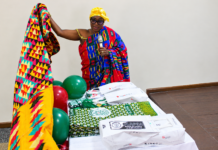 OLAPSA Launches Centenary ALUMNI Celebration And Homecoming HRM Nana Dansoa Amamaah, the Asamankese Kyidom Hemaa unveiling the Anniversary Cloth and sourvinirs during the launch