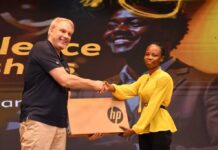30 Years Of Brightening Lives: 500 Brilliant But Needy Students And Teachers To Benefit From MTN Bright Scholarships Stephen Blewett, CEO of MTN Ghana presenting a laptop to one of the beneficiaries